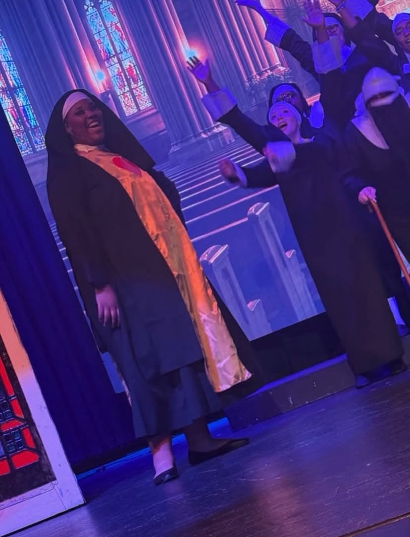 Sister Act performers in costume on the Gallatin stage